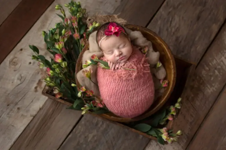 newborn baby surrounded by flowers by Cream n Cocoa Photography in Cincinnati Ohio.