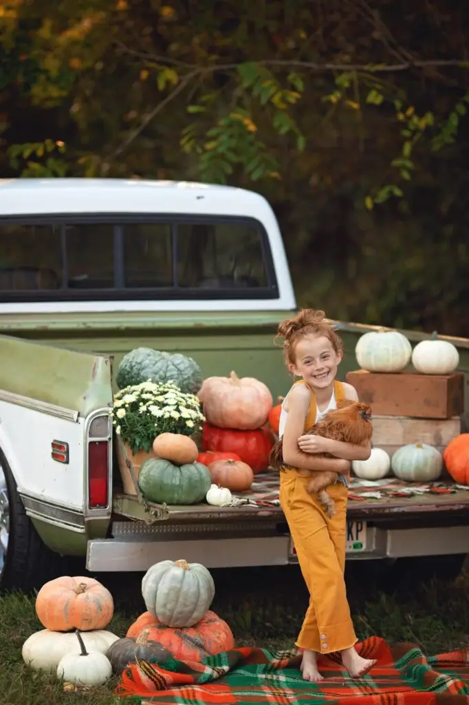 Fine Art Portrait photographer in Cincinnati took this photo of a child infront of pumpkins
