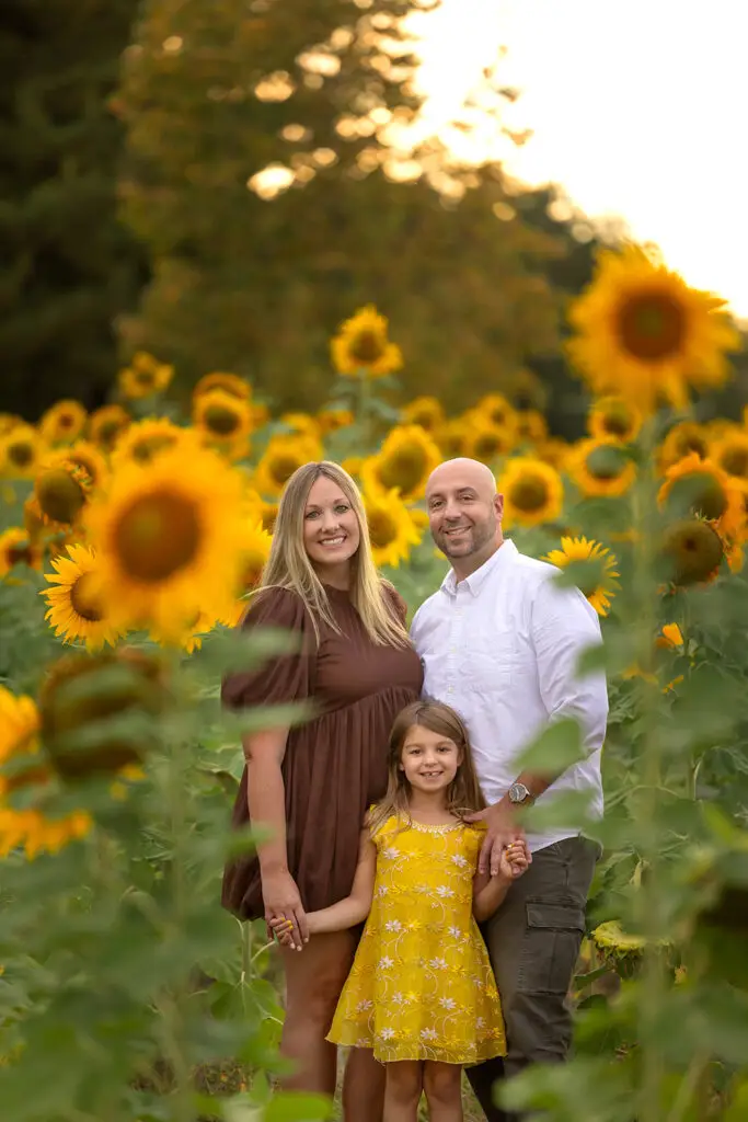 family photography session in sunflower field with parents and children Cincinnati photographer