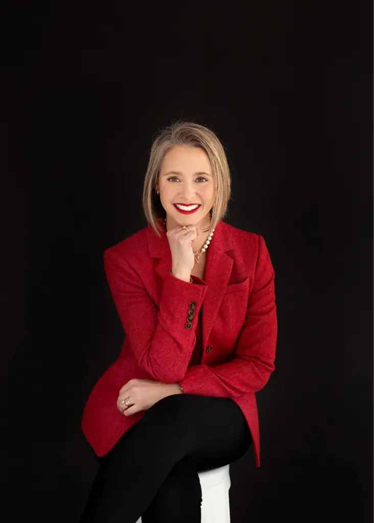 Professional female executive in a red blazer during a Cincinnati brand photography session